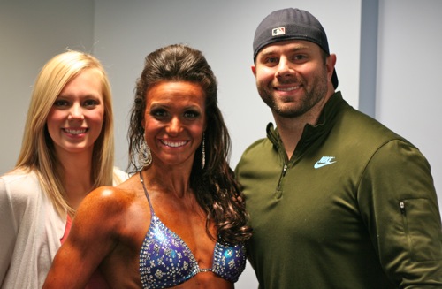 famale bodybuilder with family